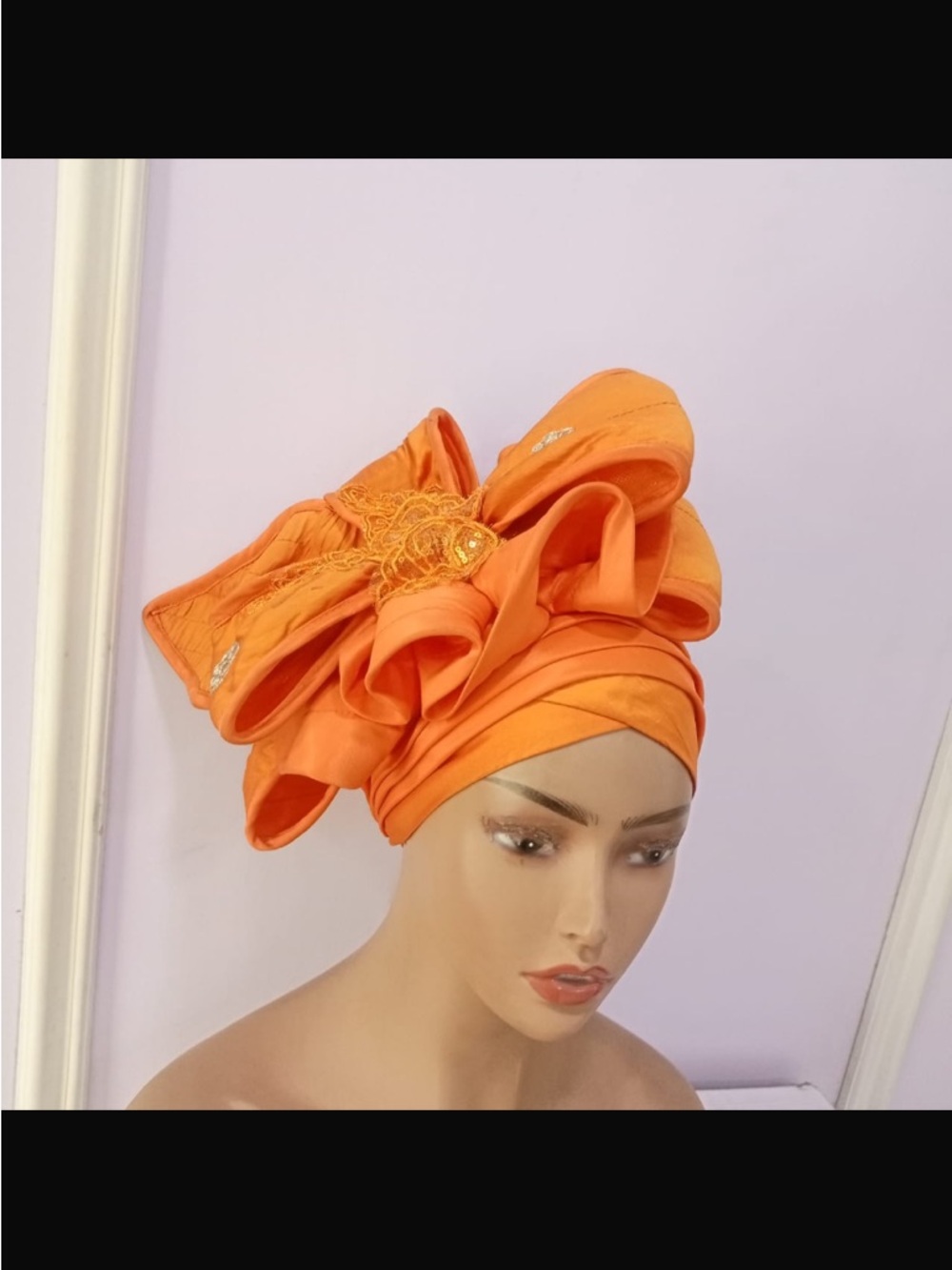 Elegant Orange Headwrap Gele with Decorative Bow